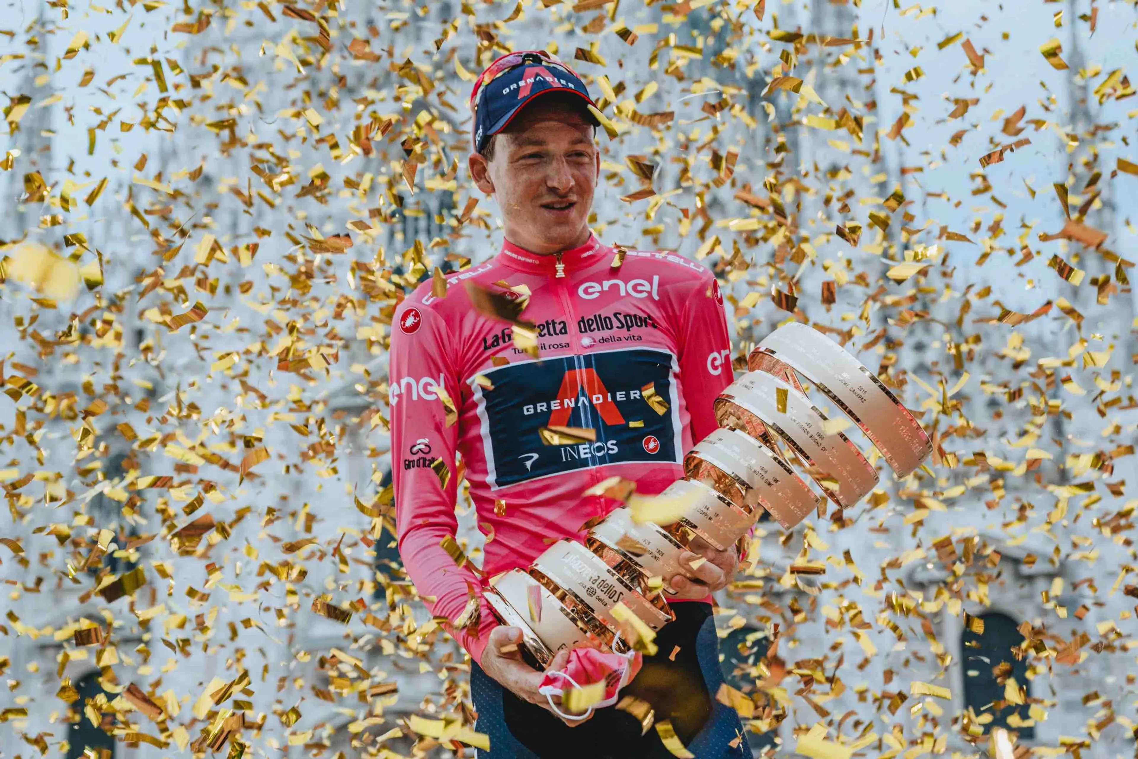 Russ Ellis (2019 Giro d'Italia winner) with the Maglia Rosa jersyey and Trofeo Senza Fine